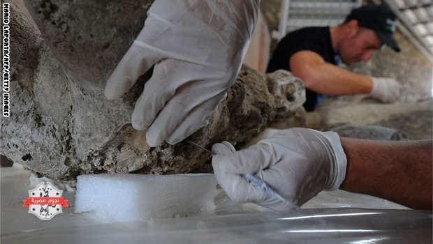 A restorer works on a petrified victim of the eruption of Vesuvius volcano in 79 BC، as part of the restoration work and the study of 86 casts in the laboratory of Pompeii Archaeological Site، on May 20، 2015 in Pompeii. AFP PHOTO / MARIO LAPORTA (Photo credit should read MARIO LAPORTA/AFP/Getty Images)